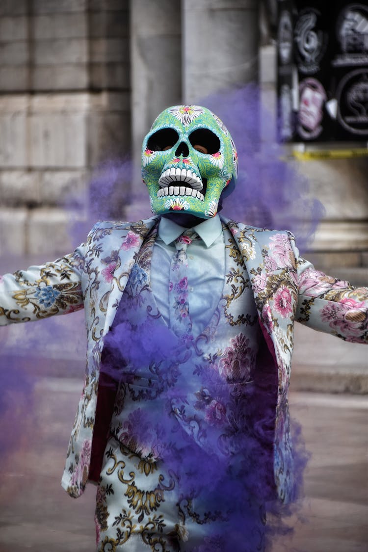 Person In A Floral Pattern Suit And A Skull Mask