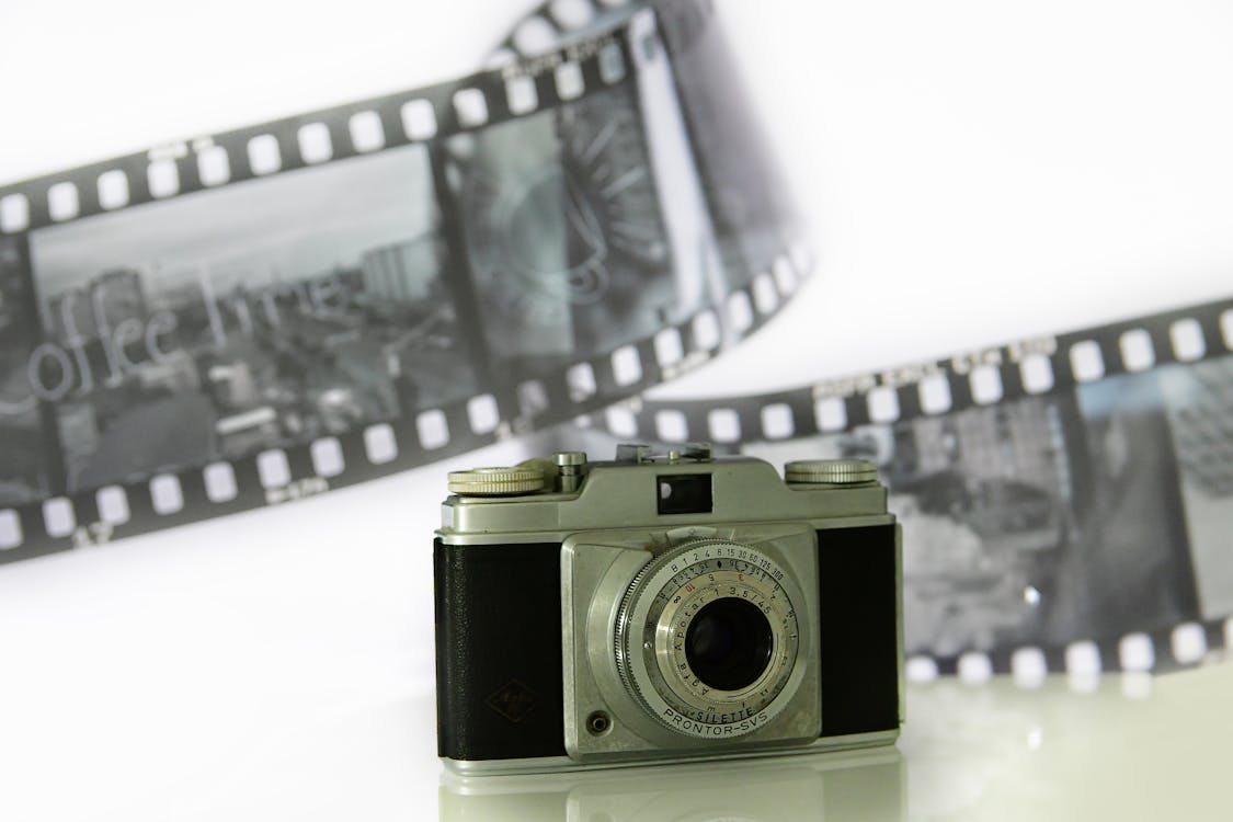Vintage Camera and Film in a Studio · Free Stock Photo