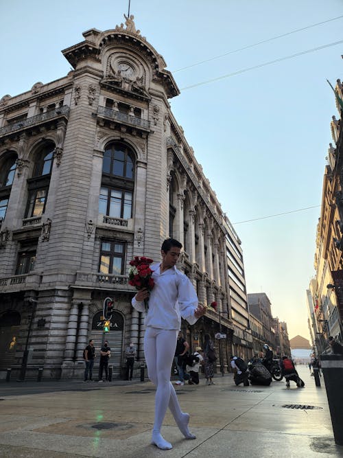 A Ballet Dancer Standing Outside the Edificio La Mexicana
