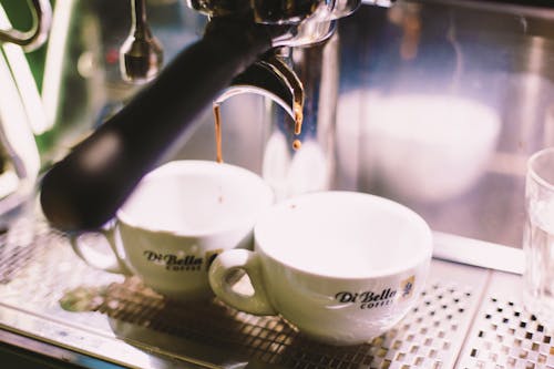 White Ceramic Cups About to Filled of Espresso