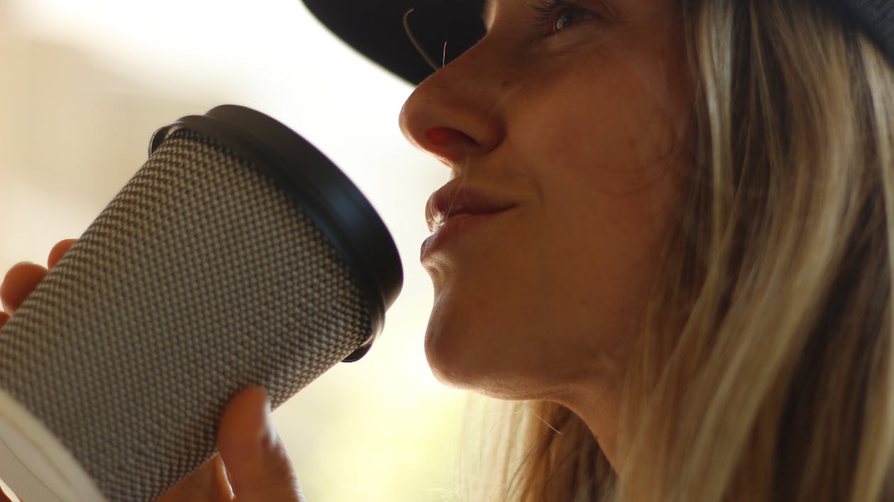 Woman Holding Gray Cup