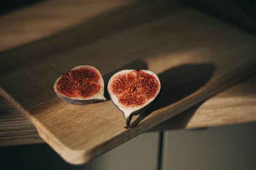 Free Halves of Fruit on Cutting Board Stock Photo