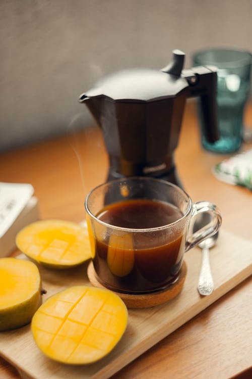 Free Steaming Coffee with Fresh Mango Stock Photo