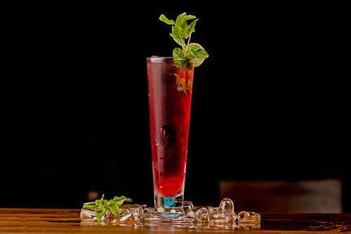 Clear Drinking Glass With Red Liquid and Ice