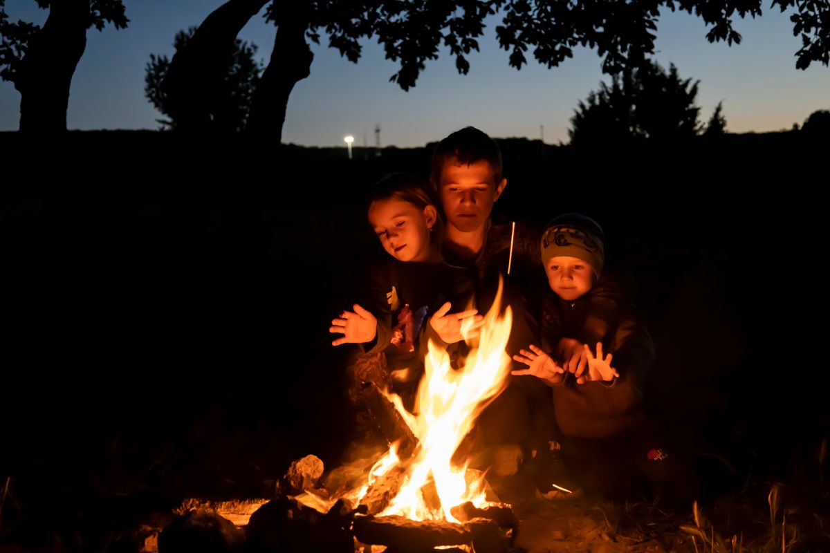 Campers around a fire at night