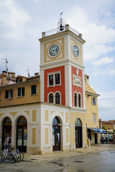 A picturesque clock tower in Rovinj's city center showcasing historic architectural beauty.