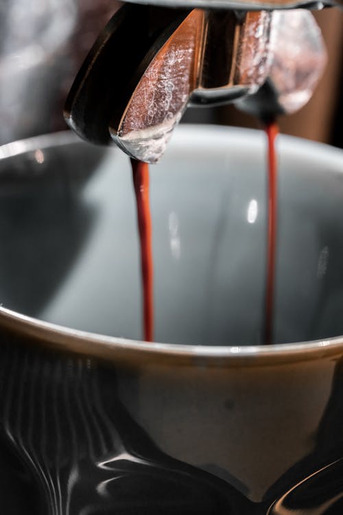 Free Close-up of Coffee Dripping into a Cup Stock Photo