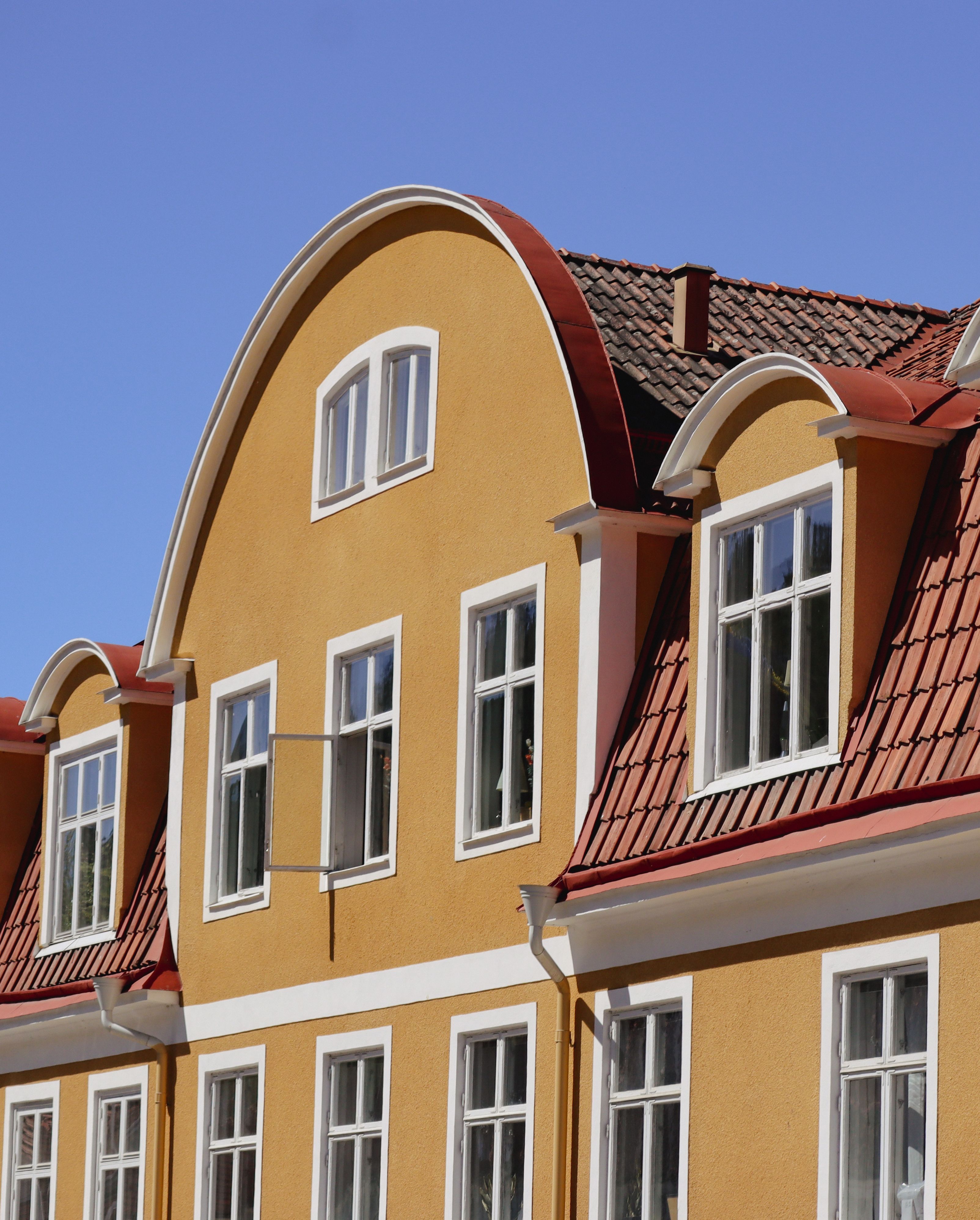 facade of a traditional building in city under blue sky