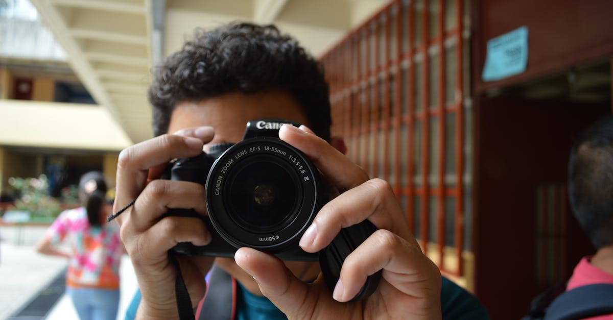 Person Holding Black Dslr Camera · Free Stock Photo Person Holding Black Dslr Camera · Free Stock Photo