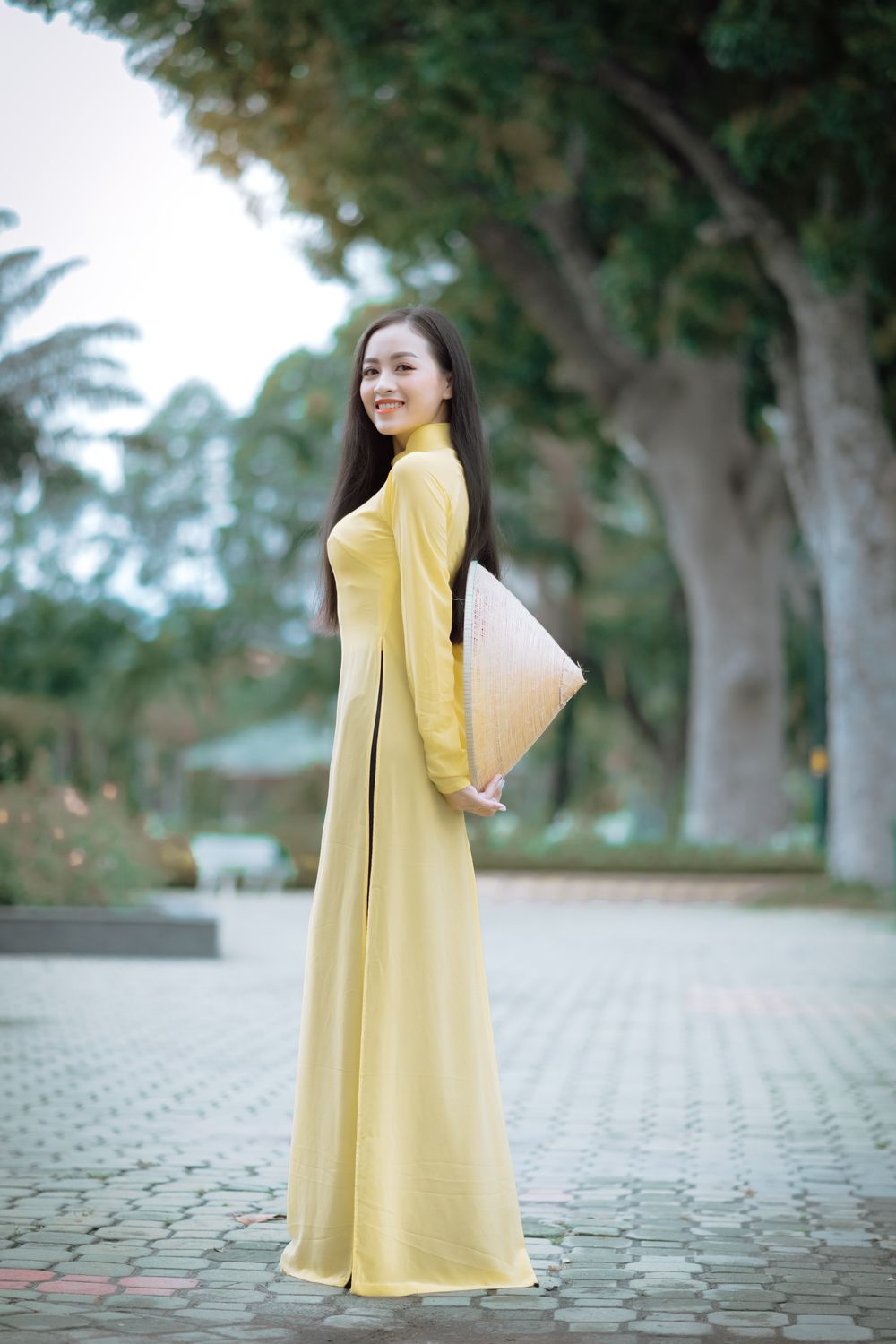 Beautiful Woman in a Traditional Yellow Dress · Free Stock Photo