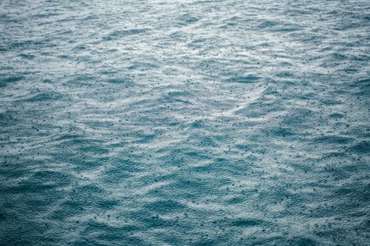 Close-up of rain creating ripples on the Adriatic Sea in Istria County, Croatia.