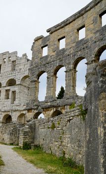 Explore the ancient Roman amphitheater ruins in Pula, showcasing stunning arches and architecture.