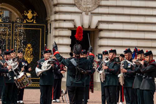 Free Gurkha military band in traditional dress performing at Buckingham Palace, London. Stock Photo