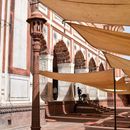 Sun Protection for Believers Before Islamic Church Facade