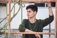 Man Leaning on Scaffolding