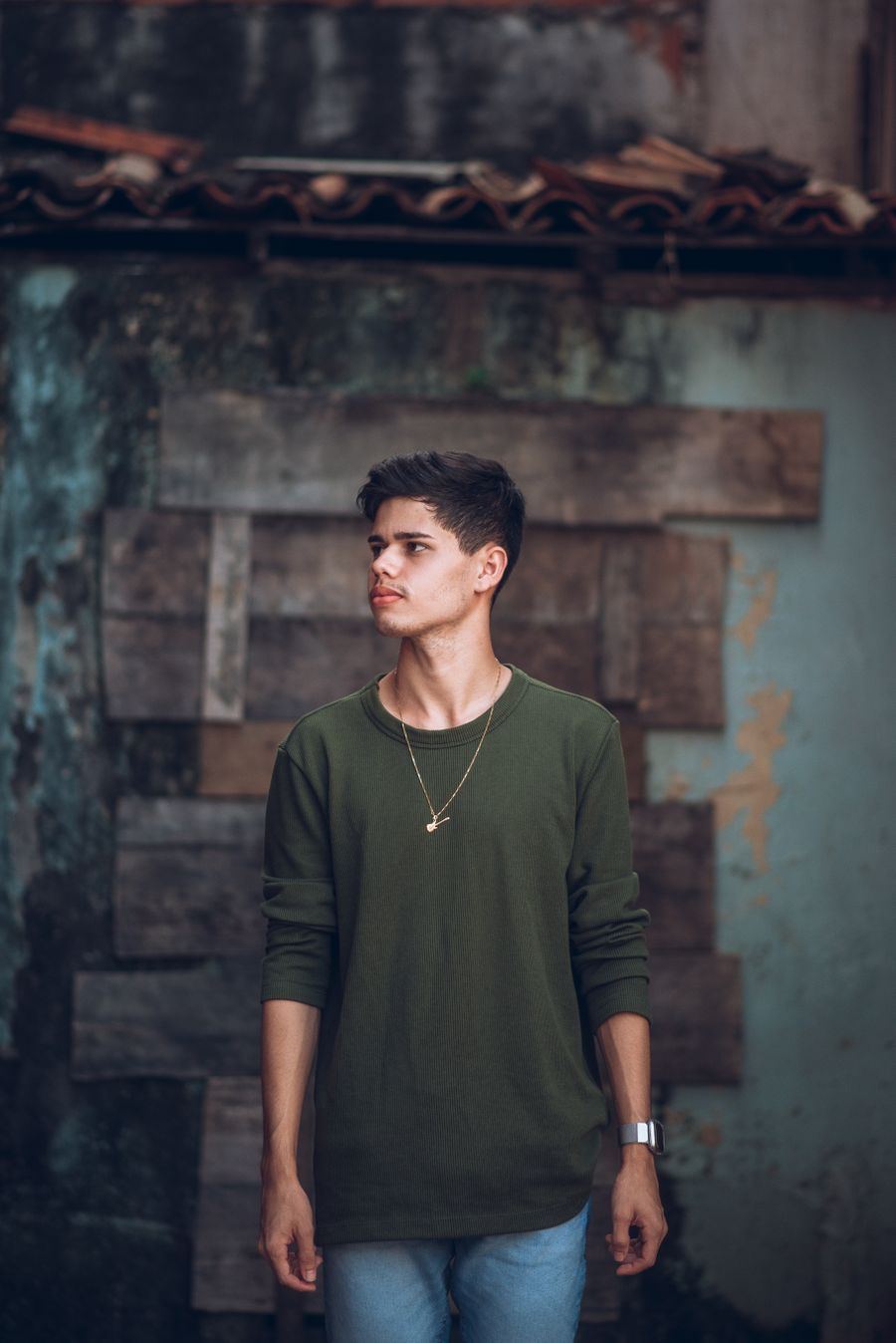 Portrait of a young man against a rustic wall — photo by Ronailson Santos on Pexels