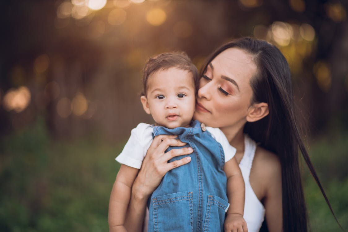 A Woman Carry Her Child