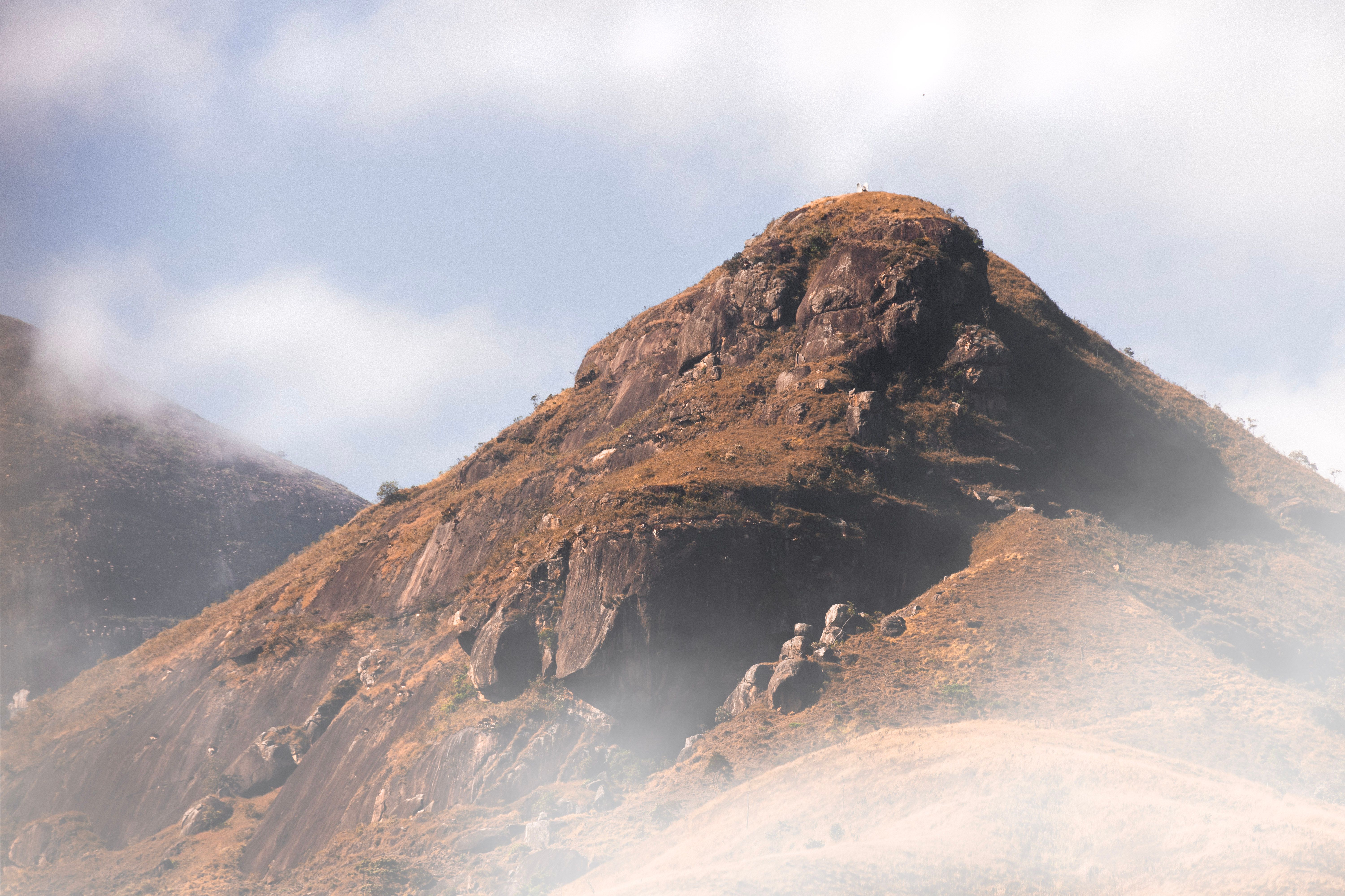 Brown rocky mountain under white clouds, Côte d'Ivoire