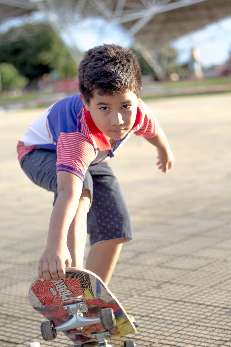 A Boy Riding A Skateboard