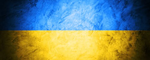 Free freedom Ukraine flag on dark concreate banner wall background  Stock Photo