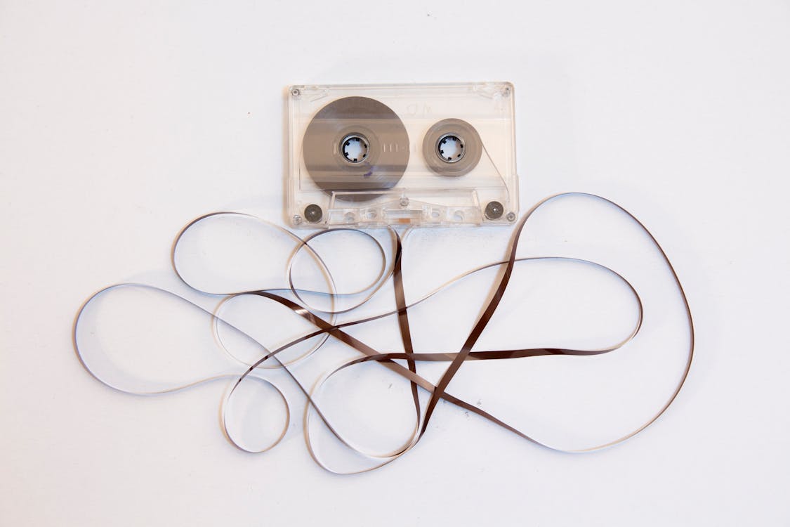 Clear Cassette Tape on White Table · Free Stock Photo