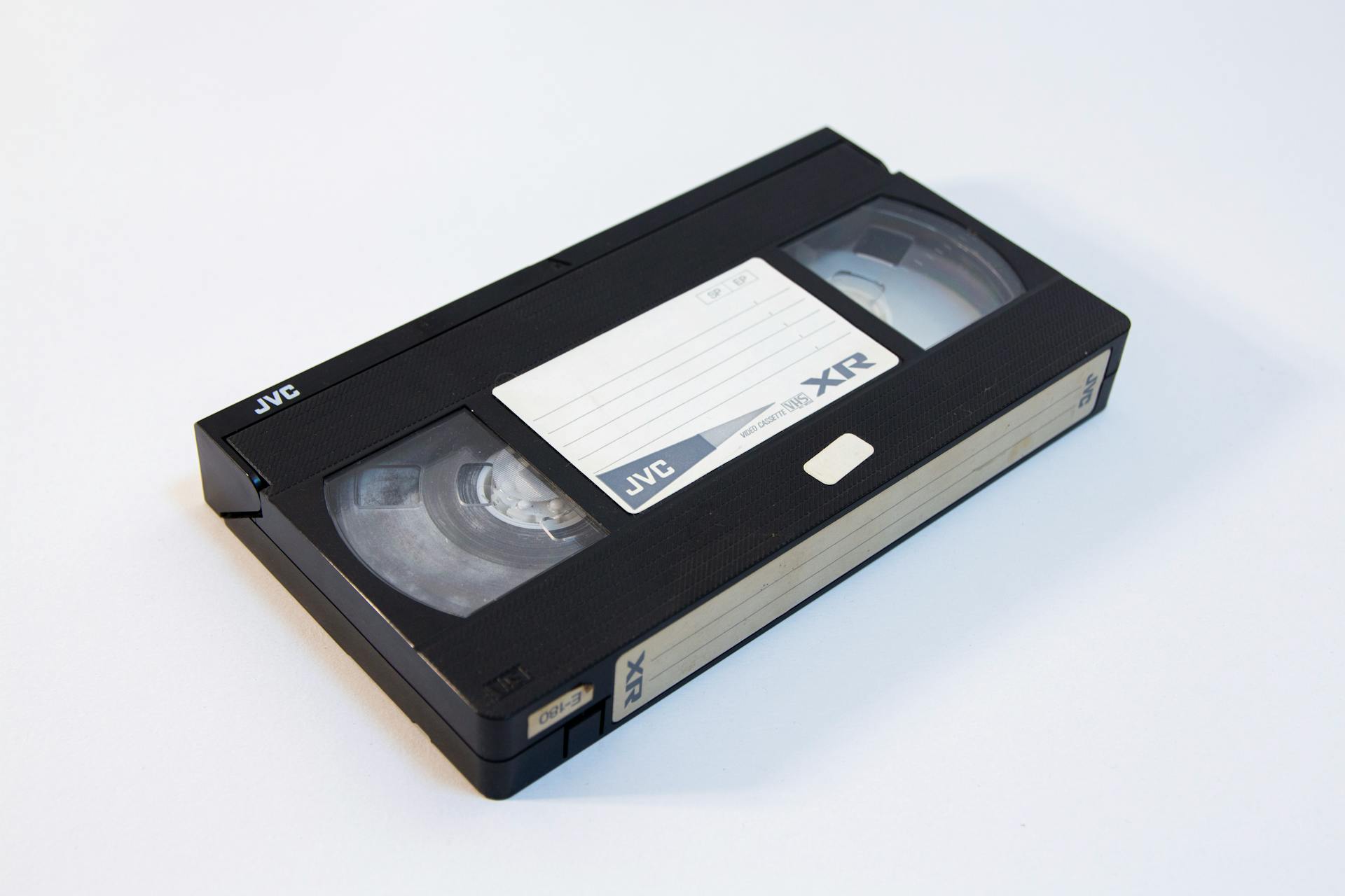 Classic VHS tape placed on a white background, showcasing retro video technology.