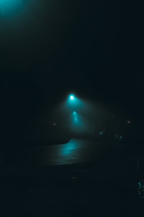 Dim Streetlight at Night in Fog 