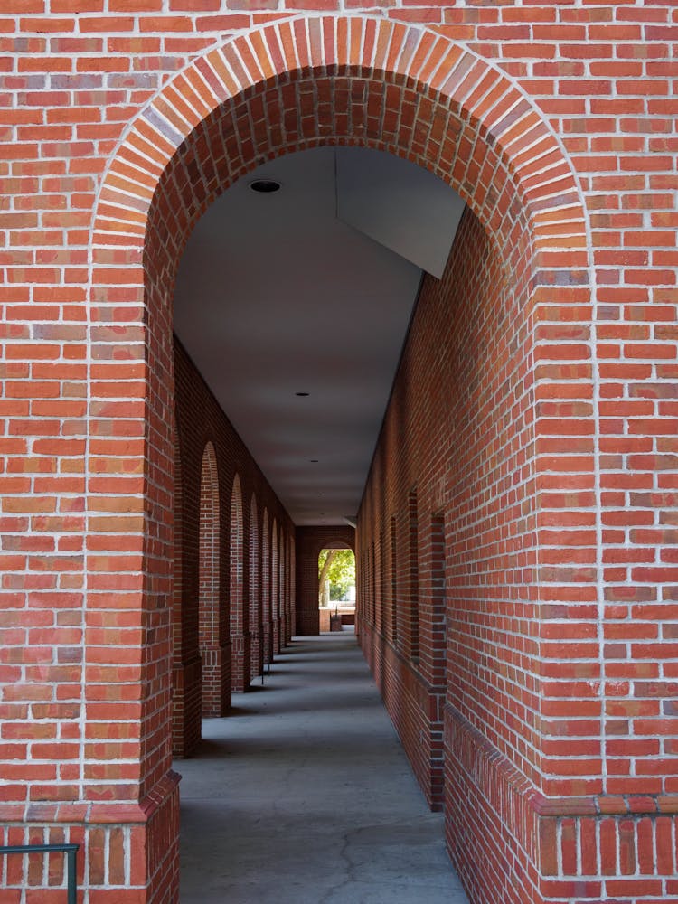 An  Arch Made Out Of Red Bricks