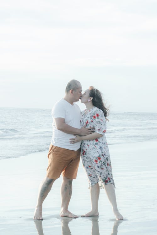 A Couple Kissing at the Beach · Free Stock Photo