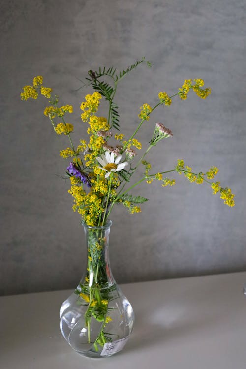 Yellow Flowers in a Glass Vase