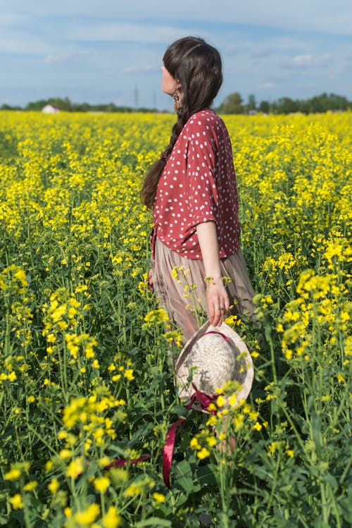 Side View of a Woman Standing in a Field