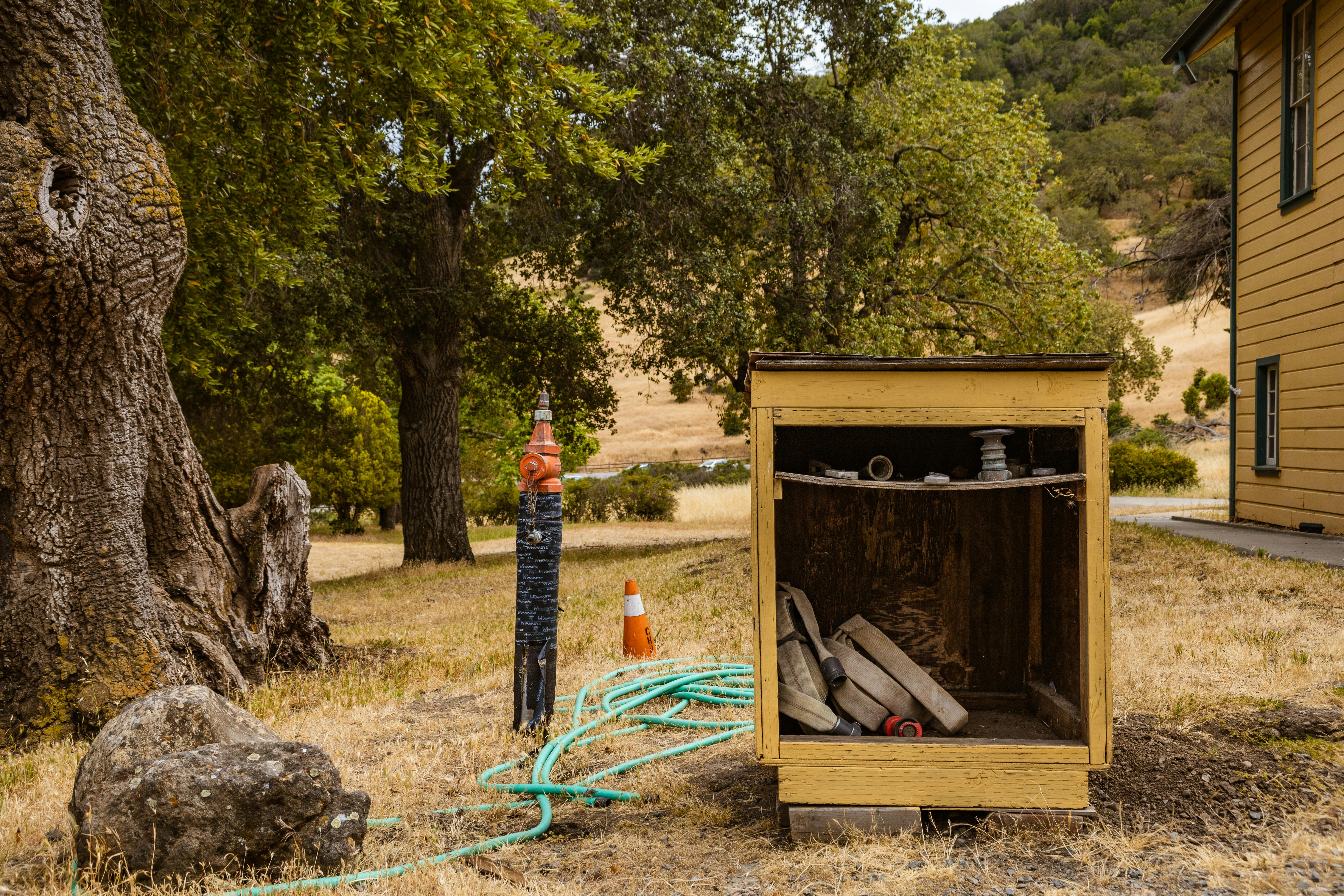 Lattice Screen Hiding Utility Boxes In A Landscaped Yard