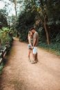 Couple Holding Hands on Park Path