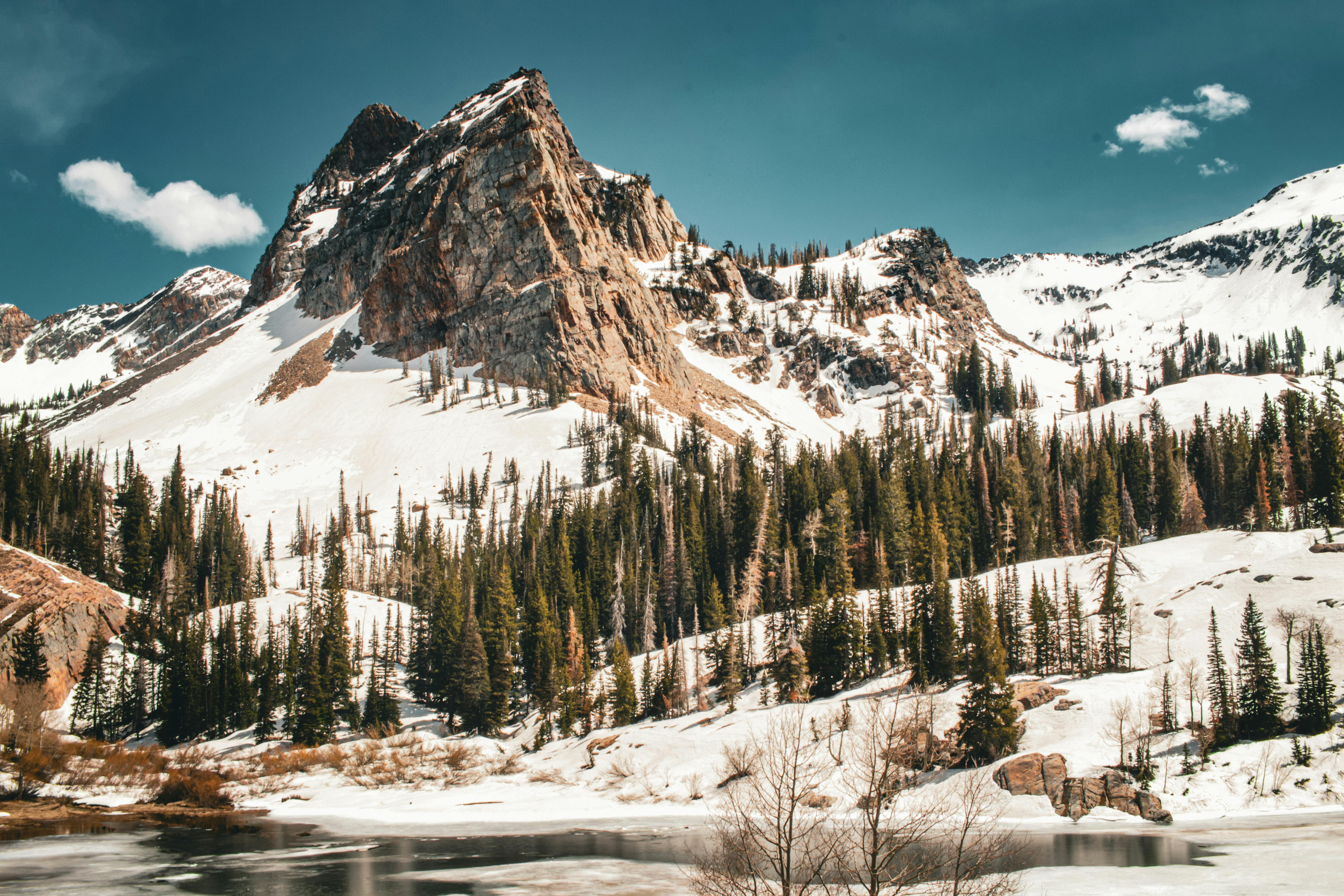 mountain in snow against blue sky