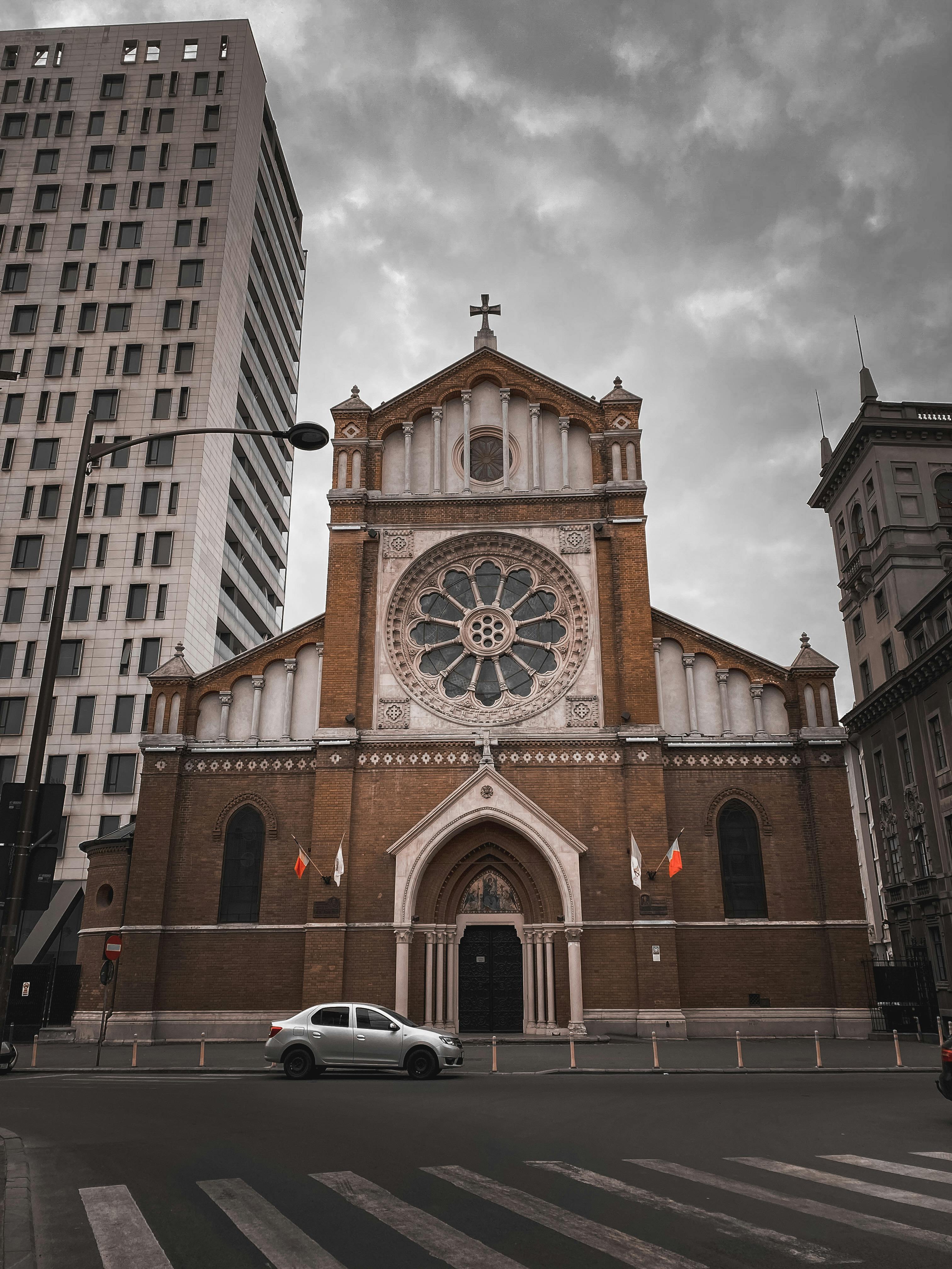 Low angle view of St. Joseph's Cathedral with cloudy sky in Bucharest, Romania.