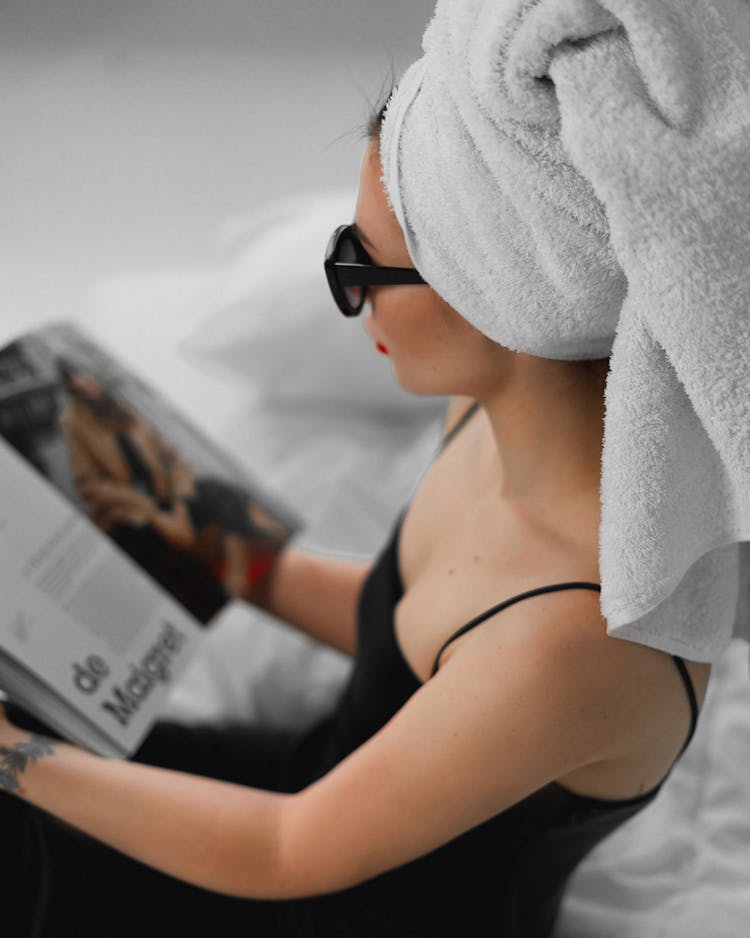 Woman Reading With Towel On Head