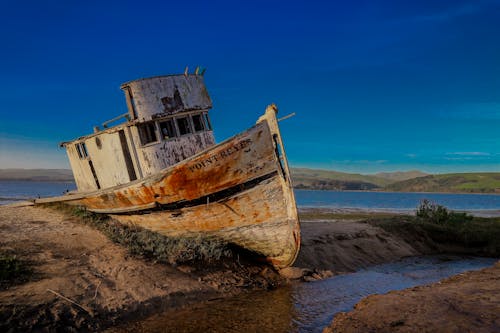 Photos gratuites de abandonné, baie, bateau