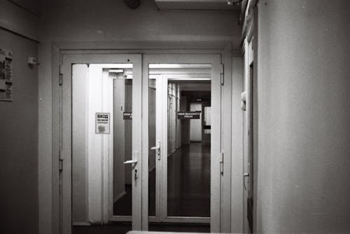 Free Black and White Photo of Doors in Hospital Corridor Stock Photo