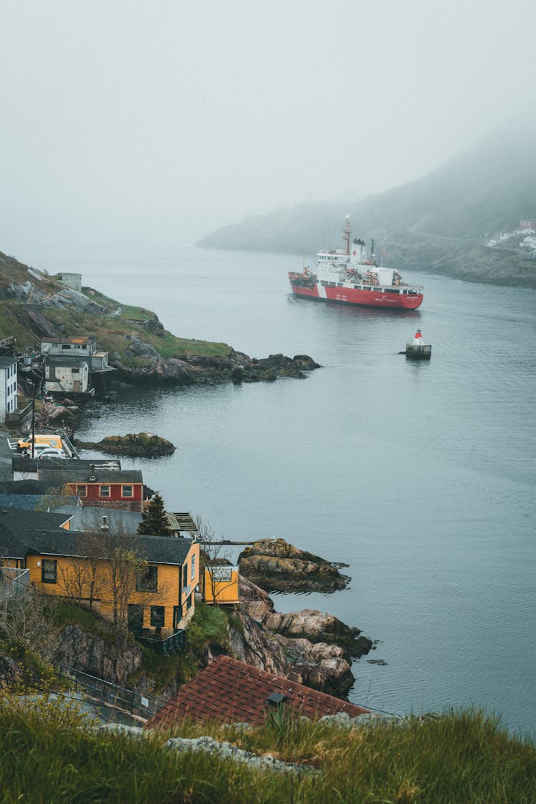 Ship In Water Near Shore In Mountains Landscape