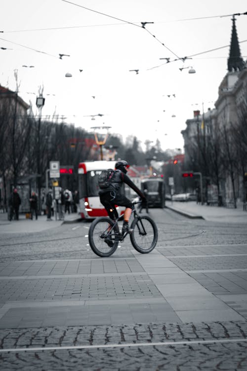 A Person Riding a Bicycle in the Street