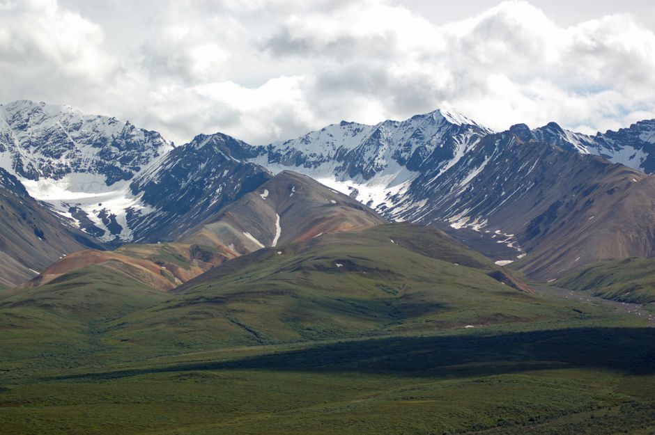 Best Alaska Ocean Wilderness Expedition Review: An Unforgettable Zodiac Adventure Through Alaska's Wild Waters Review 2026 - Breathtaking view of snowcapped mountains and green valleys under a cloudy sky.
