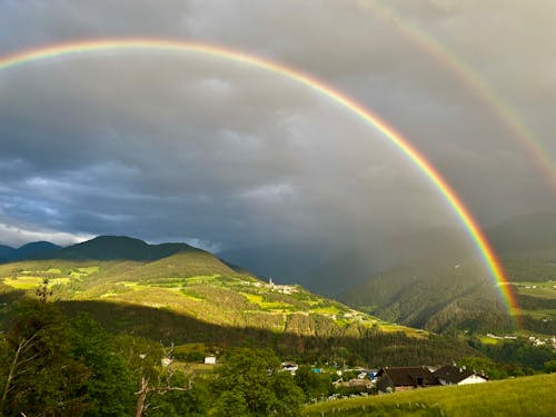 Free Green Mountains Under Rainbow Stock Photo