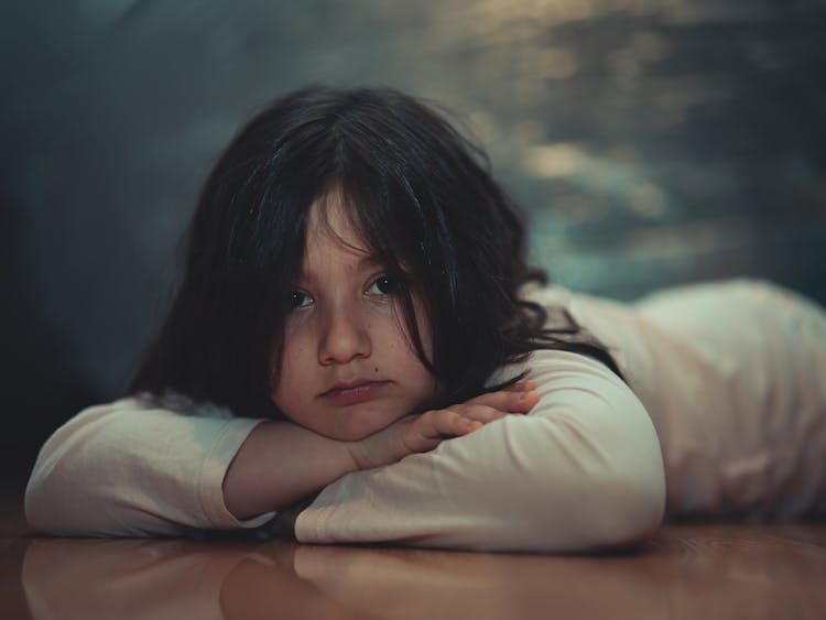 Brunette Girl Lying On Floor