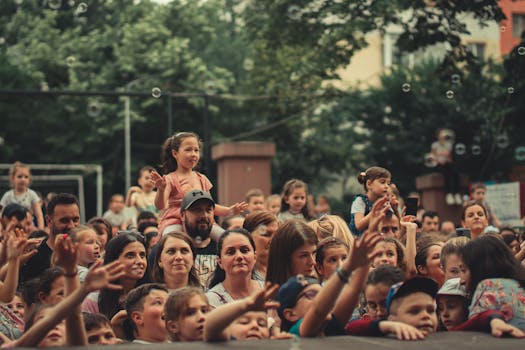 A Group of People Standing Beside the Stage 