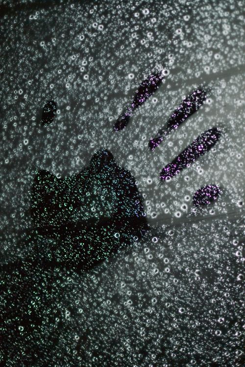 Free Clear handprint on a glass surface covered with water droplets, capturing the essence of rain and touch. Stock Photo
