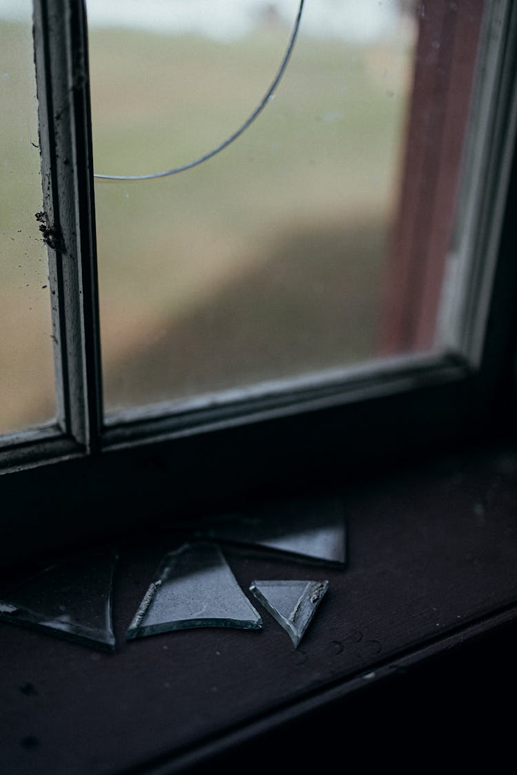 Broken Window Glass On Windowsill