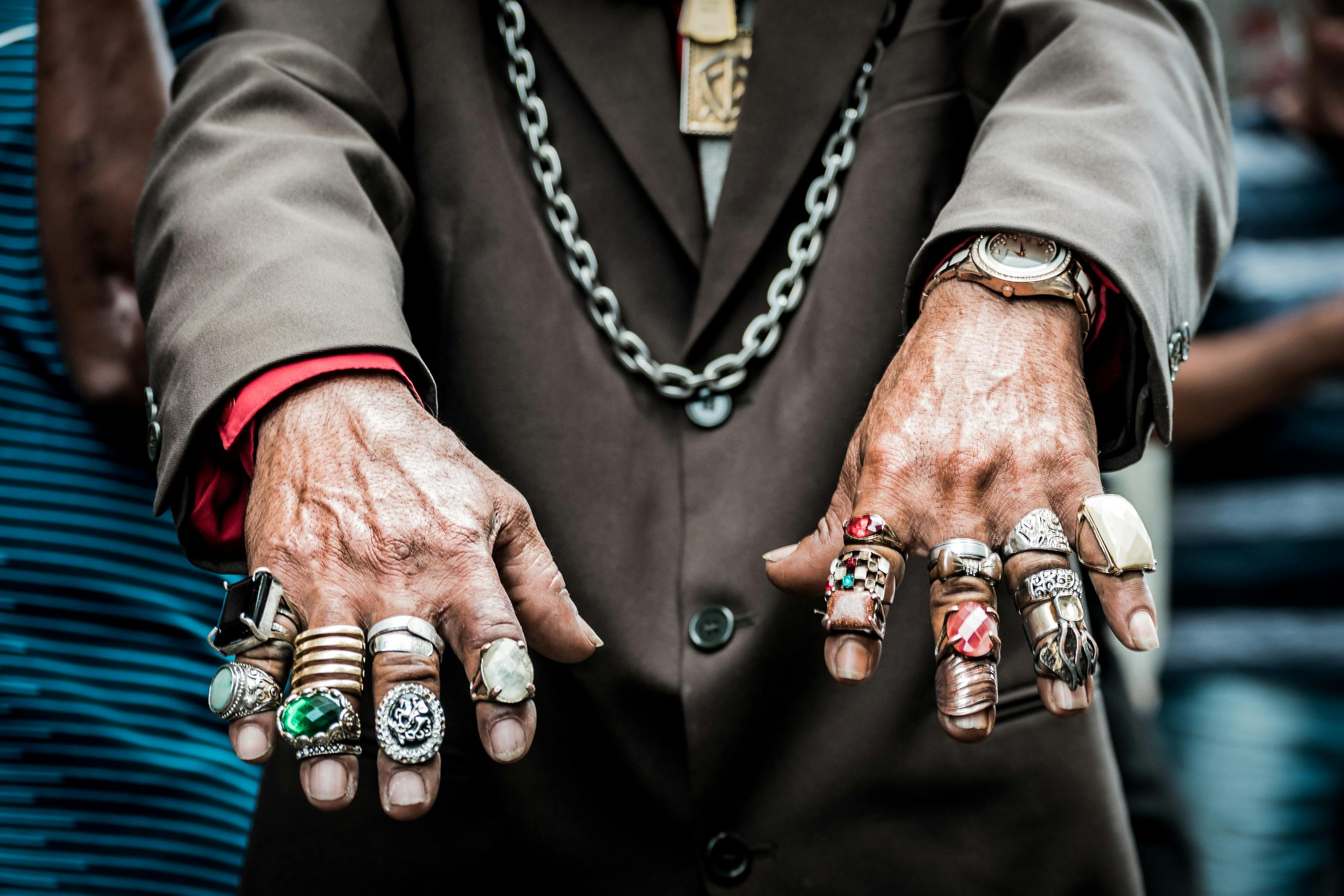Close-up of multiple rings stacked on a single finger