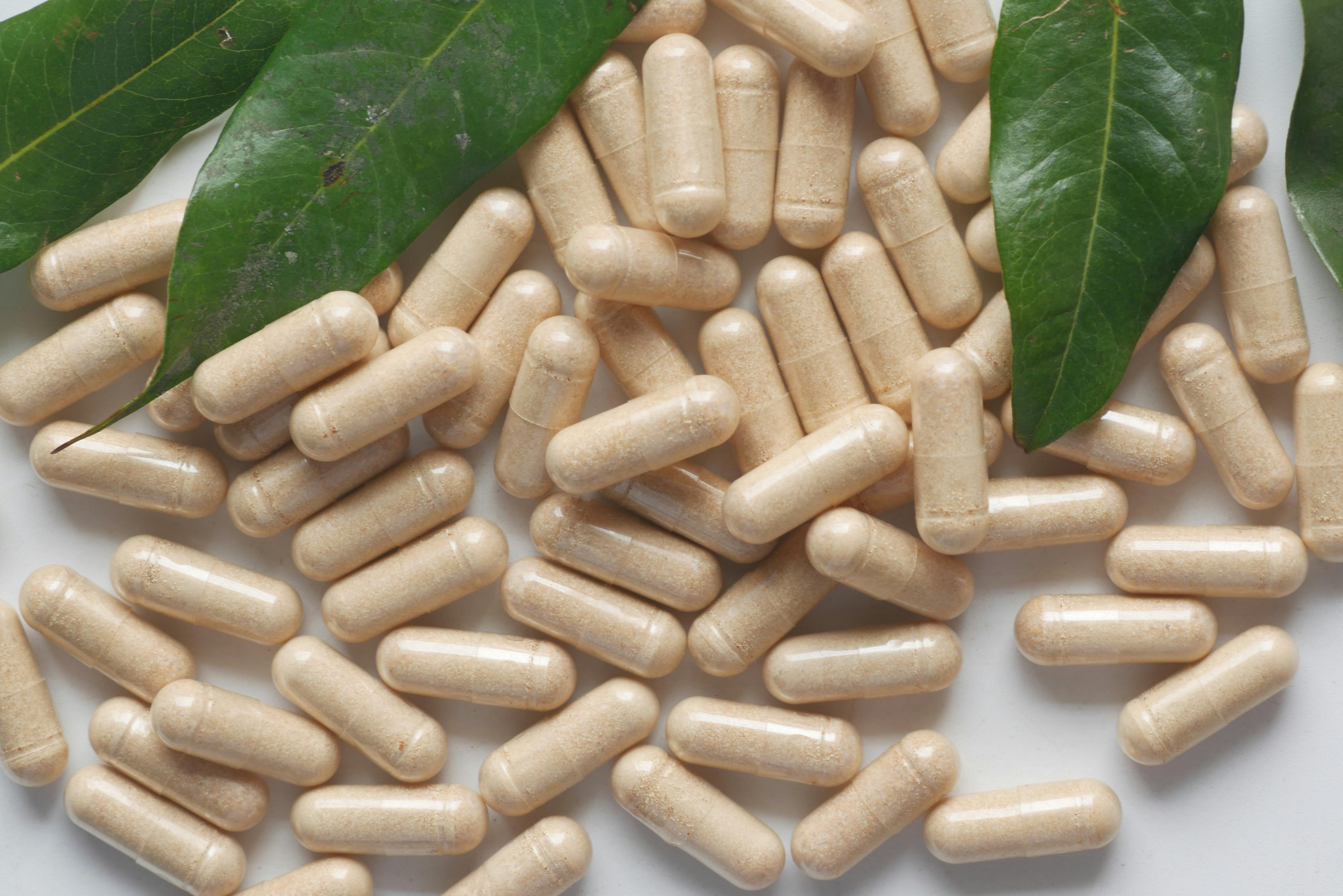 A collection of ashwagandha supplements and raw ashwagandha root, showcasing its various forms