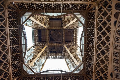 Free A detailed view of the architectural marvel from directly beneath the Eiffel Tower, Paris. Stock Photo