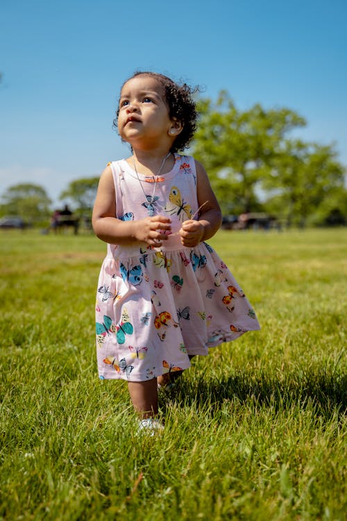 Little Girl Walking on Grass